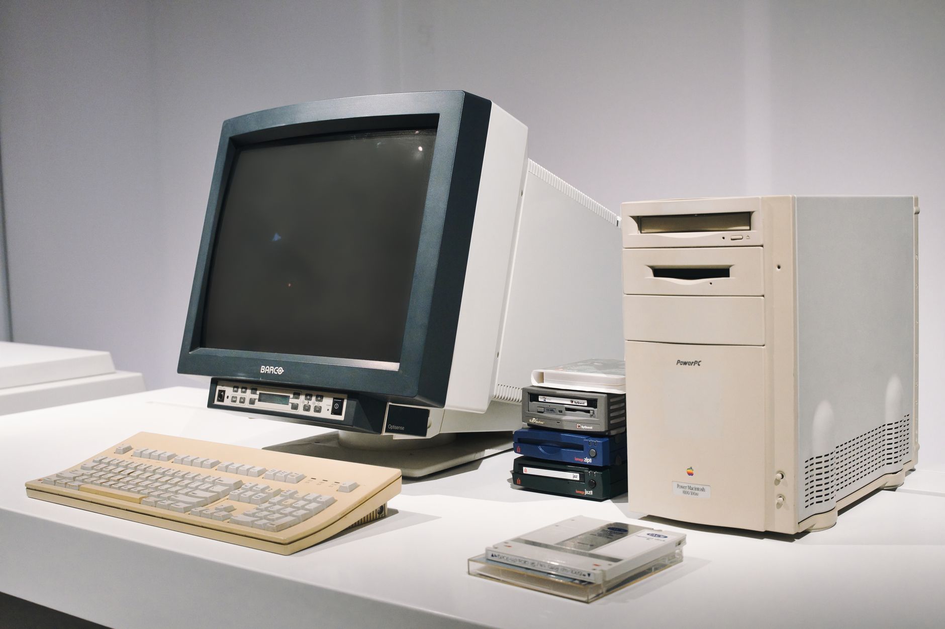 Rows of CRT computer terminals in a 1990s internet café, illustrating internet café history UK