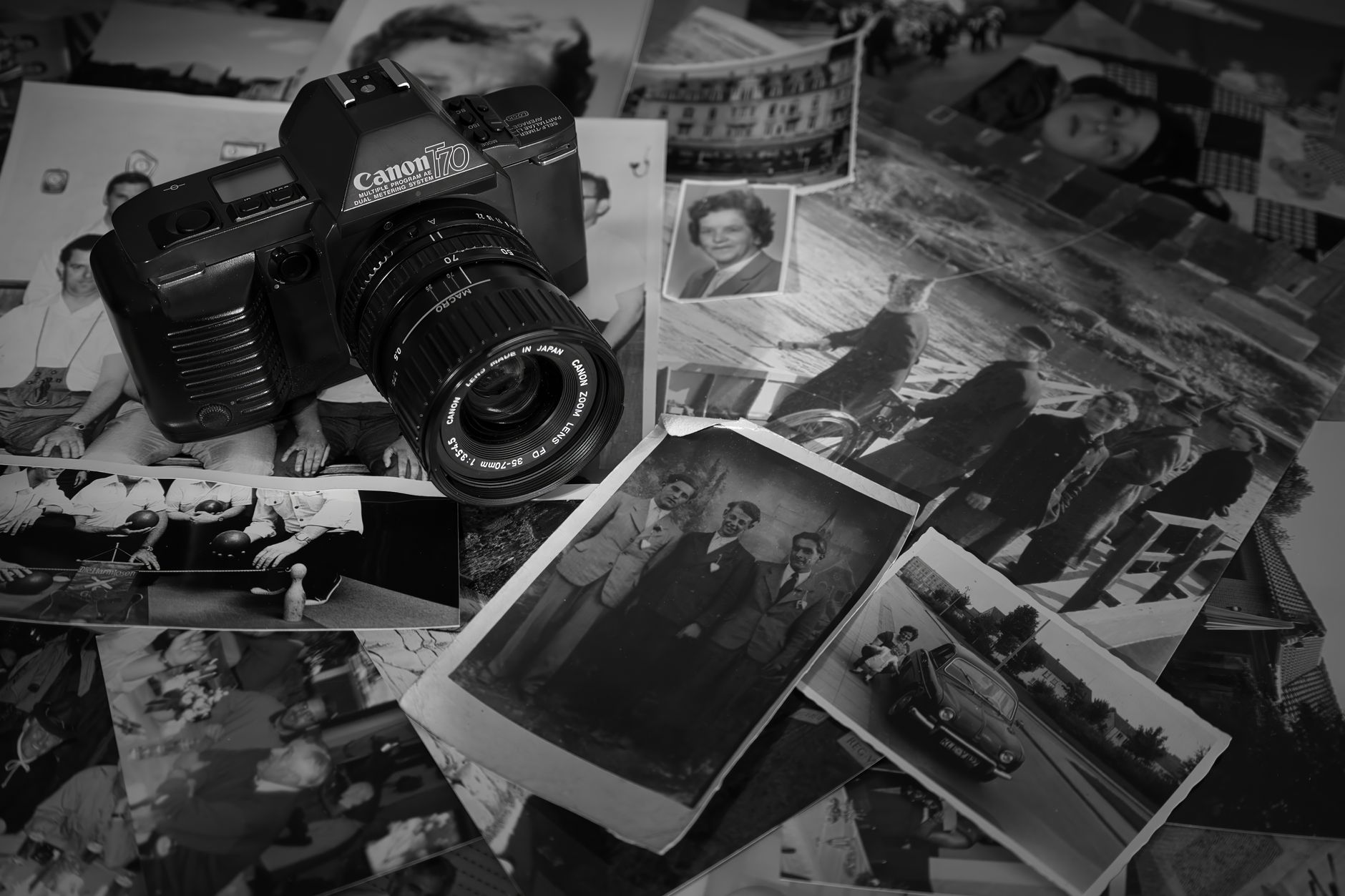 Old school photographs on a table, representing the nostalgia at the heart of Friends Reunited history