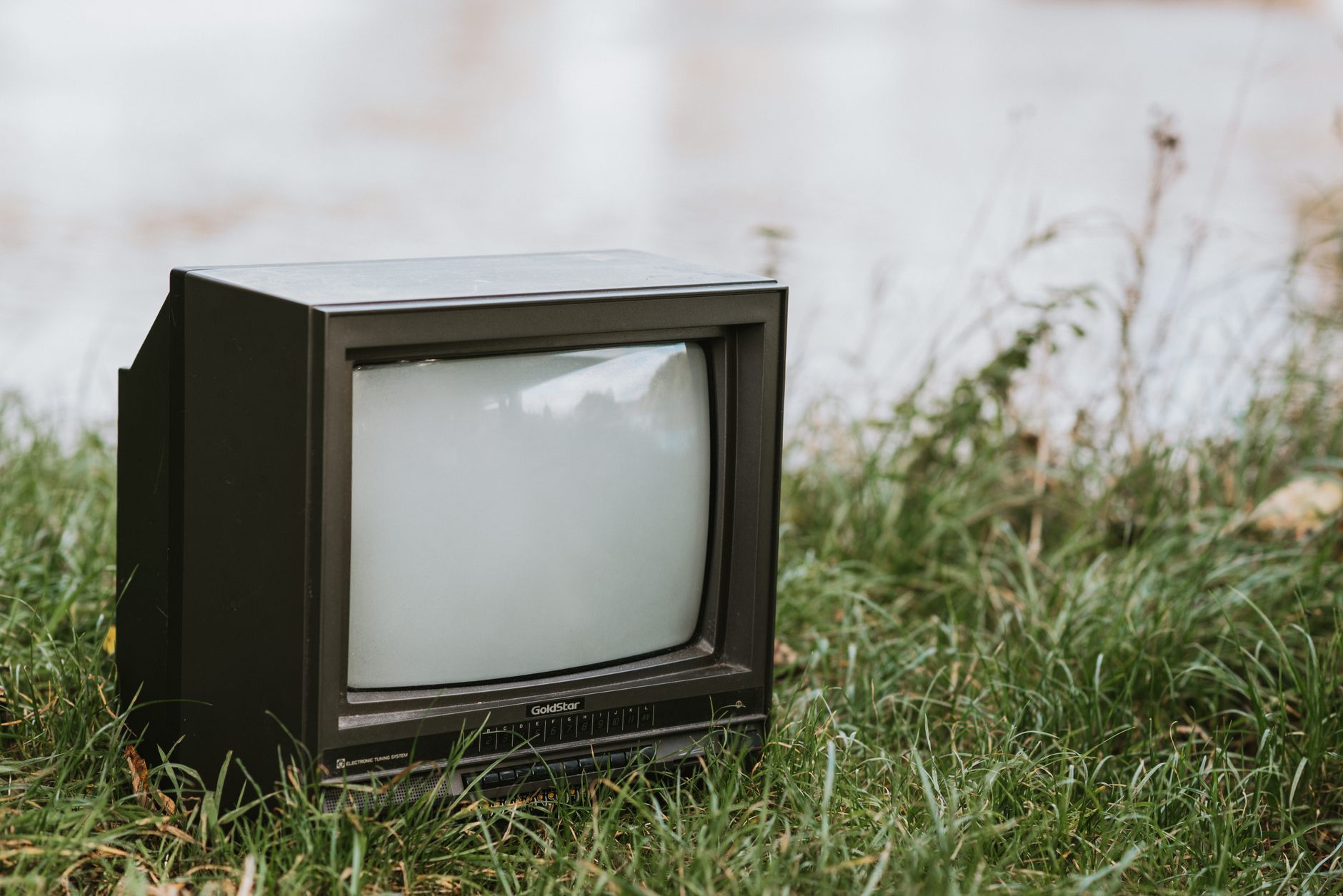 Old CRT television showing a Teletext-style cheats page, part of UK games industry online history